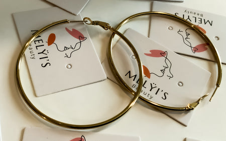 Mando Silver and Gold HoopsThese Mando Silver and Gold Hoops are the perfect go-to accessory for any daily outfit. Crafted with durable silver and gold finishes, these hoops will last through even the most active days. With their chic and timeless design,