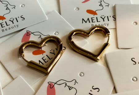 Golden Heart Shaped EarringsThese elegant golden heart shaped earrings are a perfect addition to any wardrobe. Held secure with snap clip lock technology, they are designed for comfort and long-lasting wear. Enjoy a subtle touch of beauty and glamour with