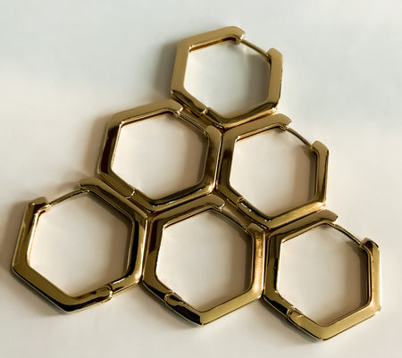 Hexagon Shaped EarringsThese stylish gold Hexagon Shaped Earrings are the perfect upgrade to any look. Crafted from high-quality materials, these earrings will make a classic addition to your jewelry collection. Create your signature style with these time