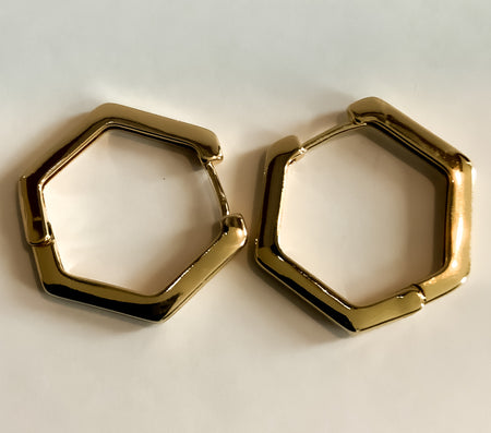 Hexagon Shaped EarringsThese stylish gold Hexagon Shaped Earrings are the perfect upgrade to any look. Crafted from high-quality materials, these earrings will make a classic addition to your jewelry collection. Create your signature style with these time