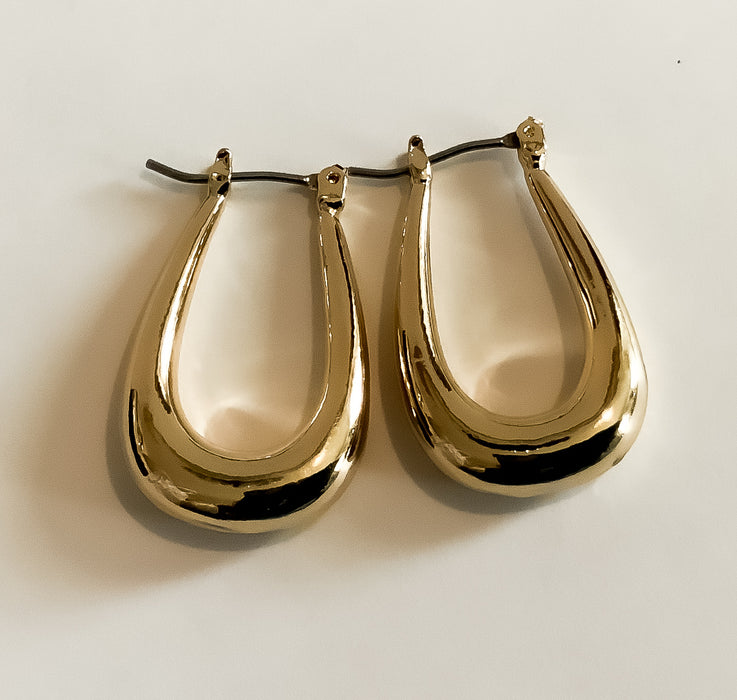 Long Gold Oval EarringsSize: 18mmLong Gold Oval EarringsSize: 18mm$7.85Melÿi’s Beauty