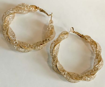 Gold Crystal twisted HoopsThese Gold Crystal twisted Hoops feature a stunning design of many small crystals, each sparkling and catching the light for a dazzling look. Crafted from gold-plated metal, their intricate design is perfect for any and all occas
