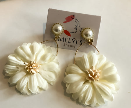 Handmade Pearl Flower EarringsOur Handmade Pearl Flower Earrings are crafted from high-quality materials and come in a variety of colors. The unique design ensures that your look will stand out in any room. Each earring is lovingly handcrafted for a stunn