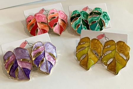 Colorful Leaf EarringsThese Colorful Leaf Earrings are a beautiful addition to any wardrobe. Crafted to look like tropical leaves, the vibrant colors bring a vibrant and unique touch to any outfit. Refresh your look with these statement earrings.Colorful