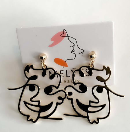 Blast from the PastThese Blast from the Past earrings feature an unique face design and are constructed from quality materials for a long-lasting look. Show off your classic movie tastes with these unique earrings.Blast from the PastThese Blast from the P