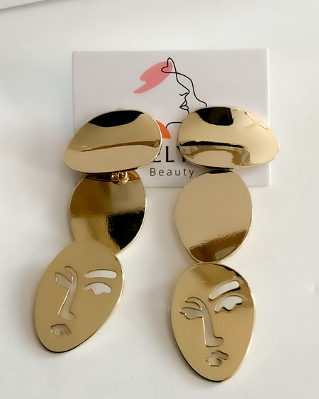 Long Face Gold EarringsThis glamorous pair of long face gold plated earrings is a timeless look perfect for any special occasion. The polished gold finish is sure to turn heads, and the delicate design ensures that the earrings are comfortable to wear.Lon