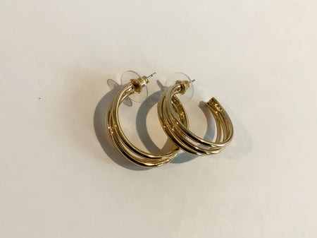 Gold Three Ring C Shaped EarringsAccentuate any look with these modern and sophisticated Gold Three Ring C Shaped Earrings. Expertly crafted from designer gold, these earrings feature a unique C-shape that is sure to draw admiring looks. Wear them for any