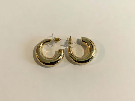 Gold Chubby C Shaped HuggiesOur Gold Chubby C Shaped Huggies are the perfect accessory for any special occasion. Crafted with high quality gold plating, these stunning earrings will add a touch of elegance and luxury to your look!Gold Chubby C Shaped Hugg