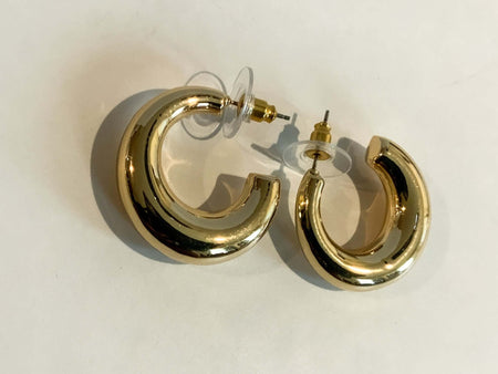 Gold Chubby C Shaped HuggiesOur Gold Chubby C Shaped Huggies are the perfect accessory for any special occasion. Crafted with high quality gold plating, these stunning earrings will add a touch of elegance and luxury to your look!Gold Chubby C Shaped Hugg