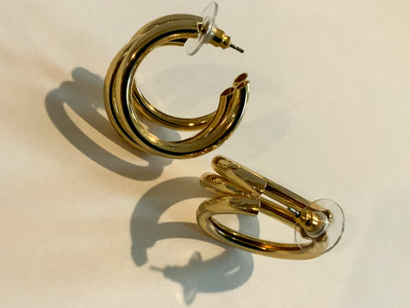 Gold Three Ring HuggiesFeaturing three separate and beautifully crafted gold rings on a huggable hoop, these Gold Three Ring Huggies earrings are perfect for adding a lasting sparkle to any look. Crafted to perfection, these earrings are great for any occ