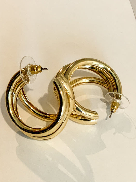 Gold Three Ring HuggiesFeaturing three separate and beautifully crafted gold rings on a huggable hoop, these Gold Three Ring Huggies earrings are perfect for adding a lasting sparkle to any look. Crafted to perfection, these earrings are great for any occ