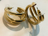 Gold Three Ring HuggiesFeaturing three separate and beautifully crafted gold rings on a huggable hoop, these Gold Three Ring Huggies earrings are perfect for adding a lasting sparkle to any look. Crafted to perfection, these earrings are great for any occ