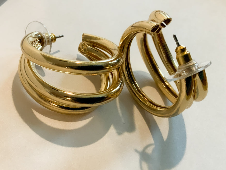 Gold Three Ring HuggiesFeaturing three separate and beautifully crafted gold rings on a huggable hoop, these Gold Three Ring Huggies earrings are perfect for adding a lasting sparkle to any look. Crafted to perfection, these earrings are great for any occ