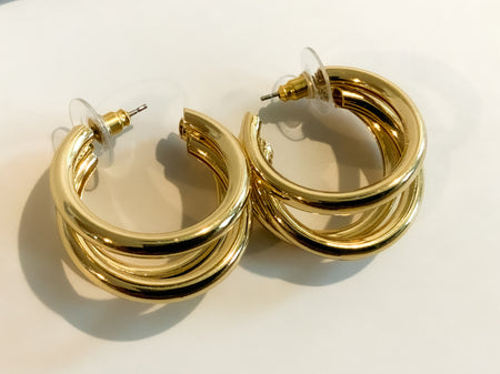 Gold Three Ring HuggiesFeaturing three separate and beautifully crafted gold rings on a huggable hoop, these Gold Three Ring Huggies earrings are perfect for adding a lasting sparkle to any look. Crafted to perfection, these earrings are great for any occ